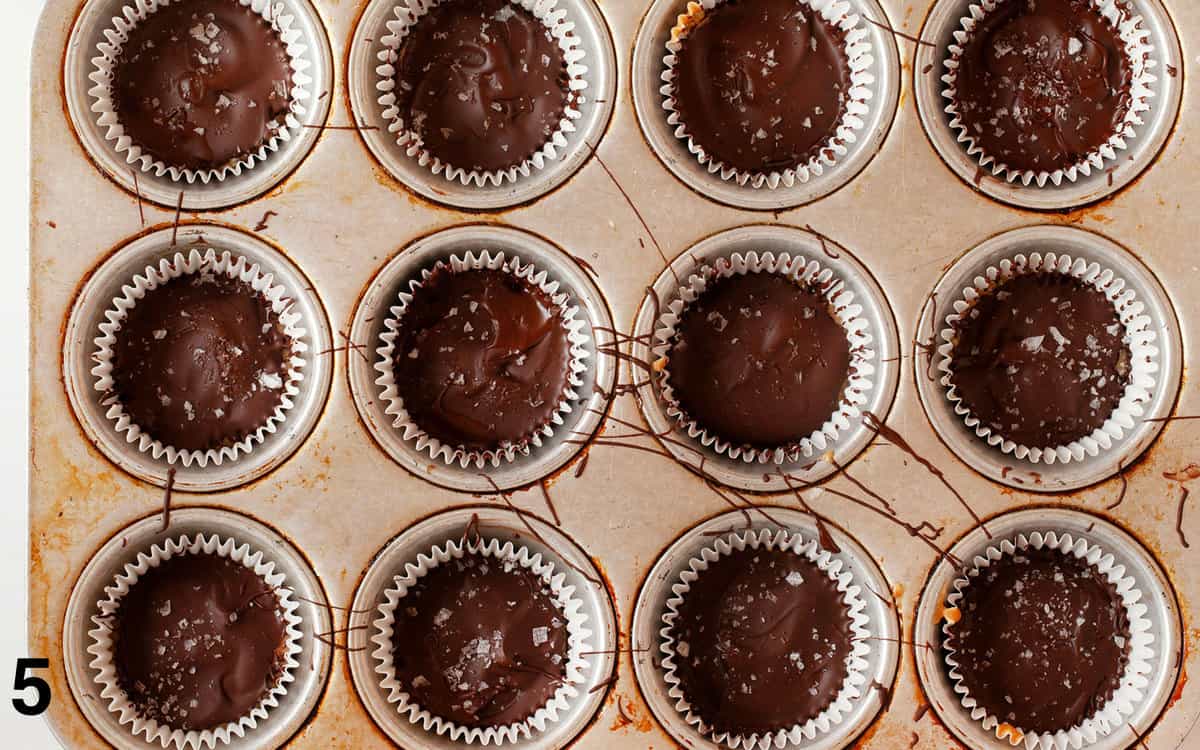 Homemade peanut butter cups in a muffin pan.