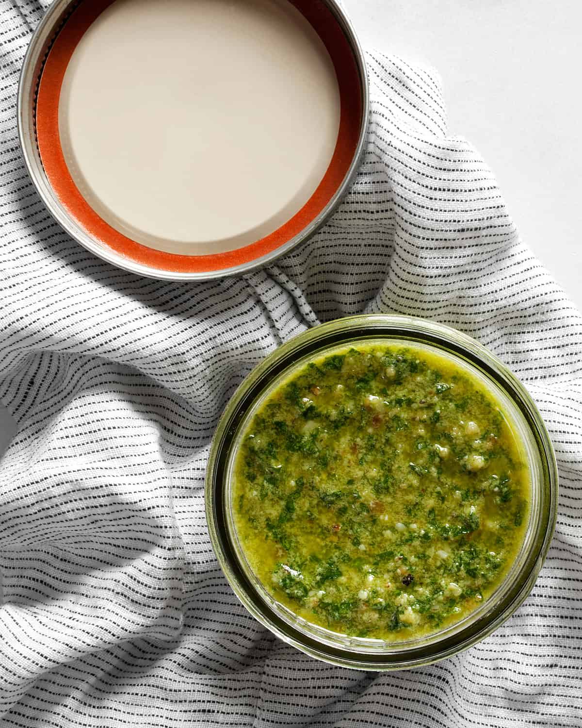 Parsley walnut pesto in a jar with the lid off.