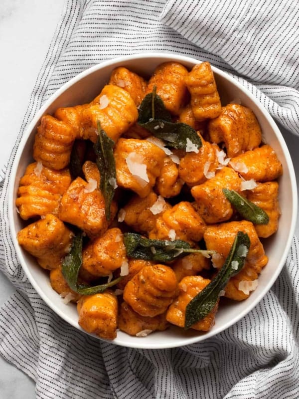 Sweet potato gnocchi with crispy sage in a bowl.