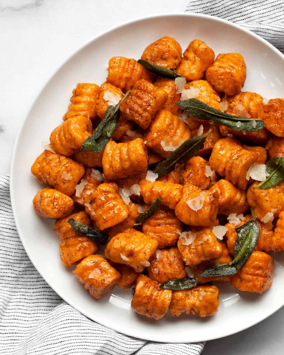 Gnocchi with sage on a plate.