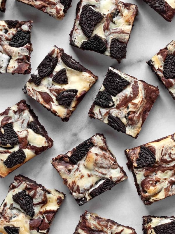 An assortment of oreo cheesecake brownies.