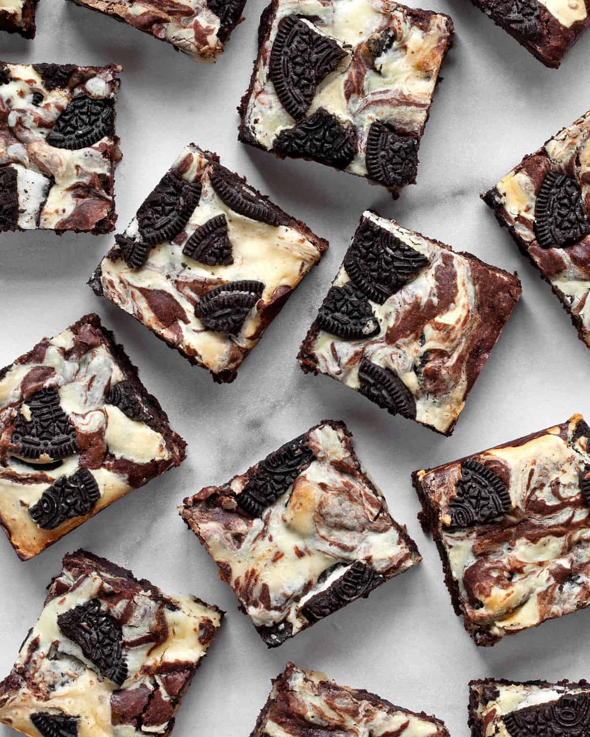 An assortment of oreo cheesecake brownies.