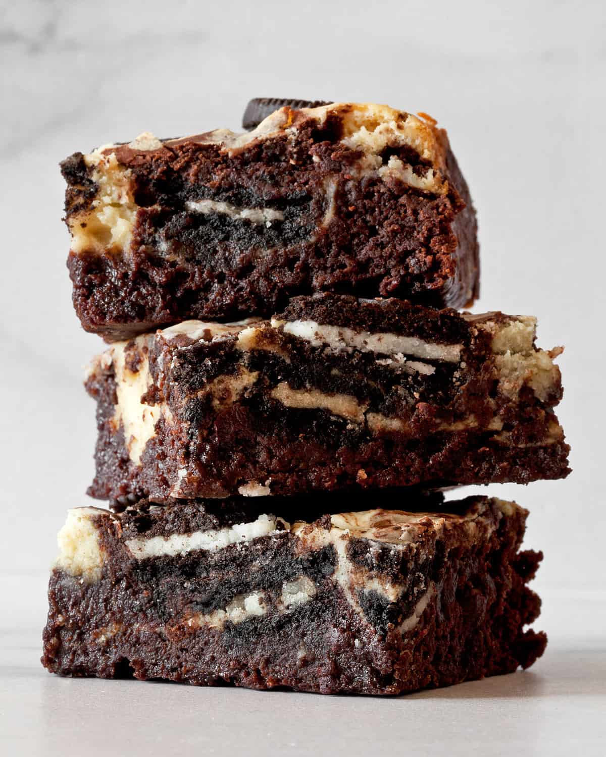 Three brownies in a stack.