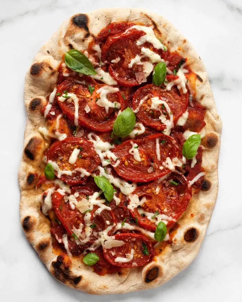 Grilled pizza with roasted tomatoes