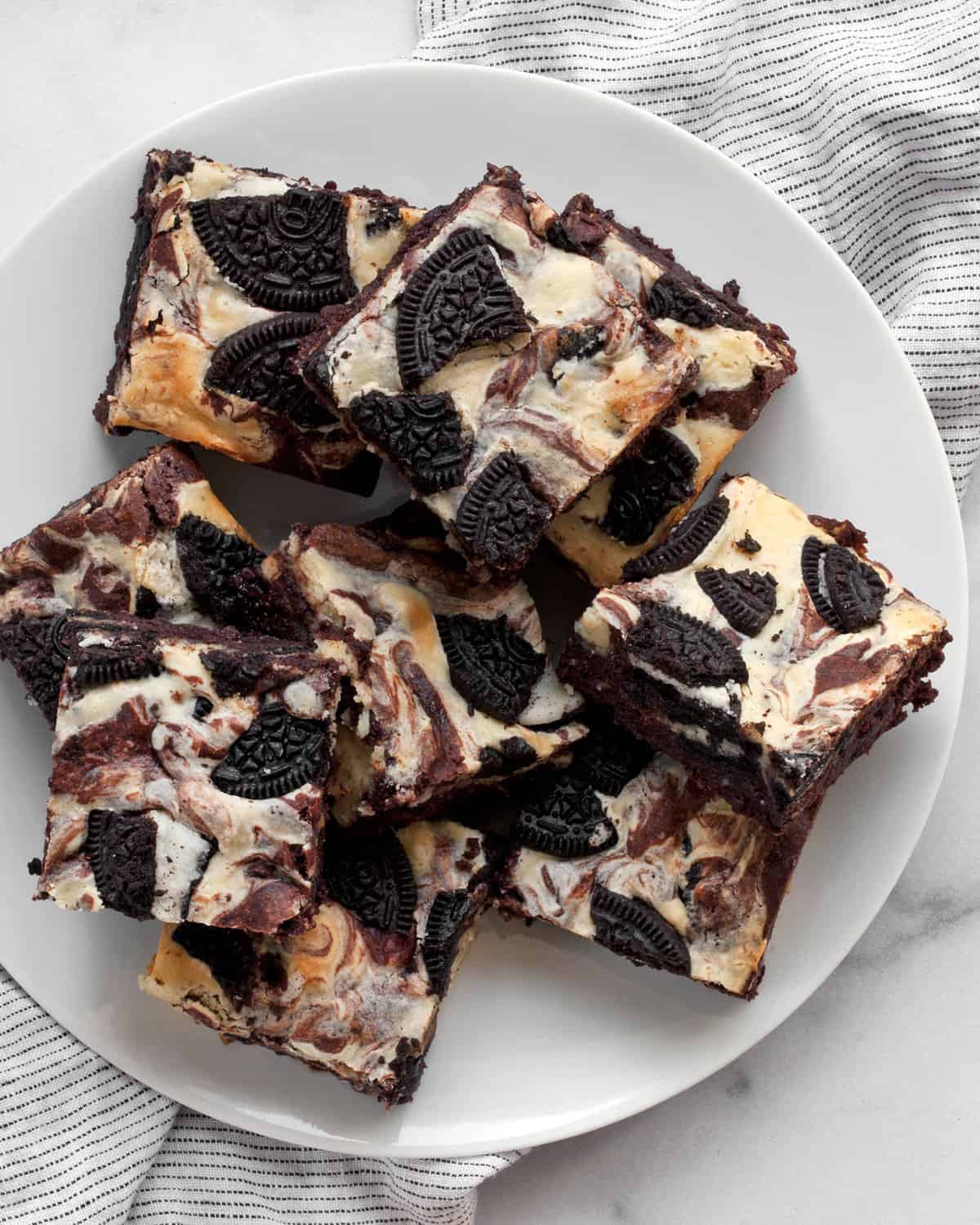 Cream cheese brownies on a plate.
