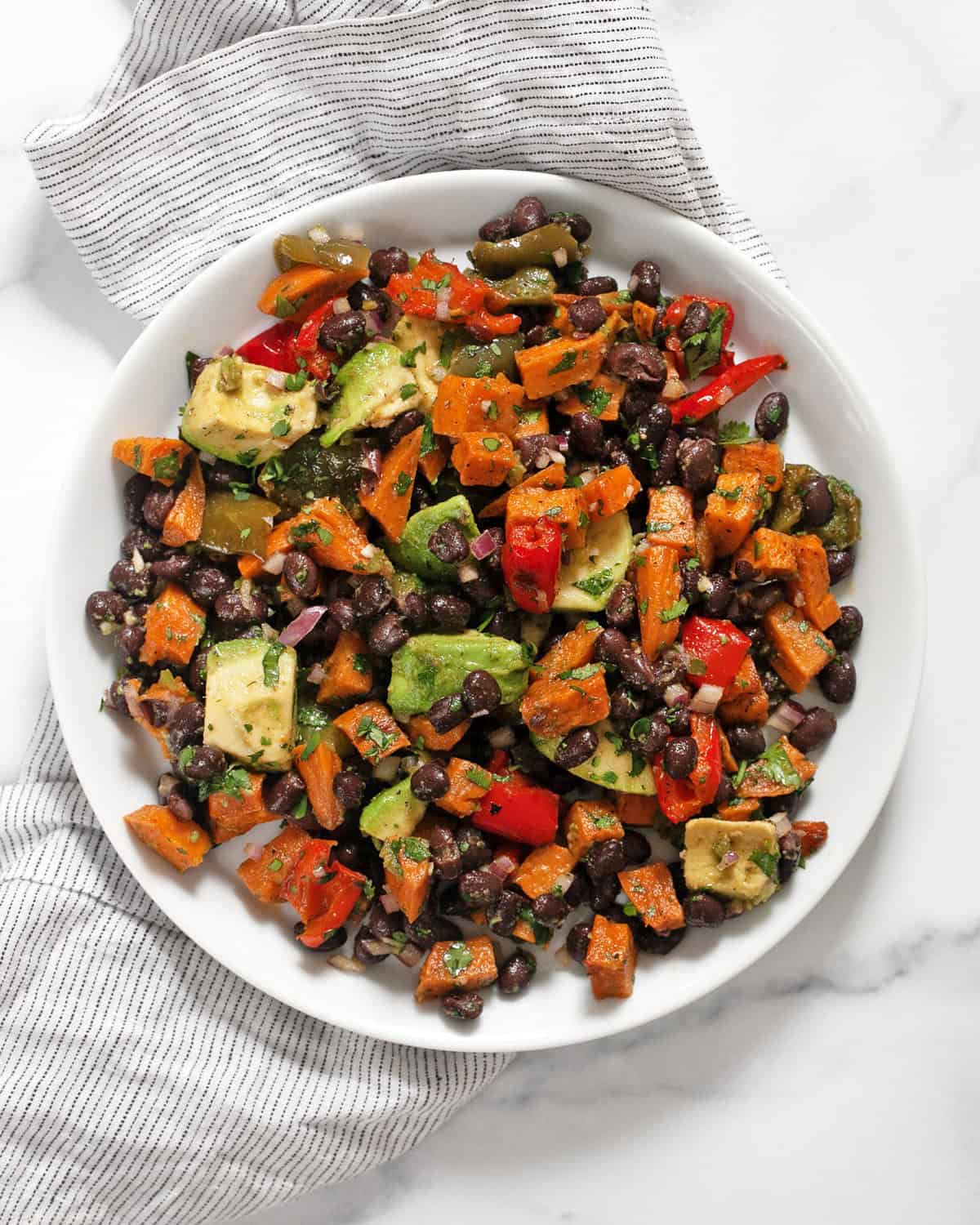 Roasted sweet potato salad on a plate.
