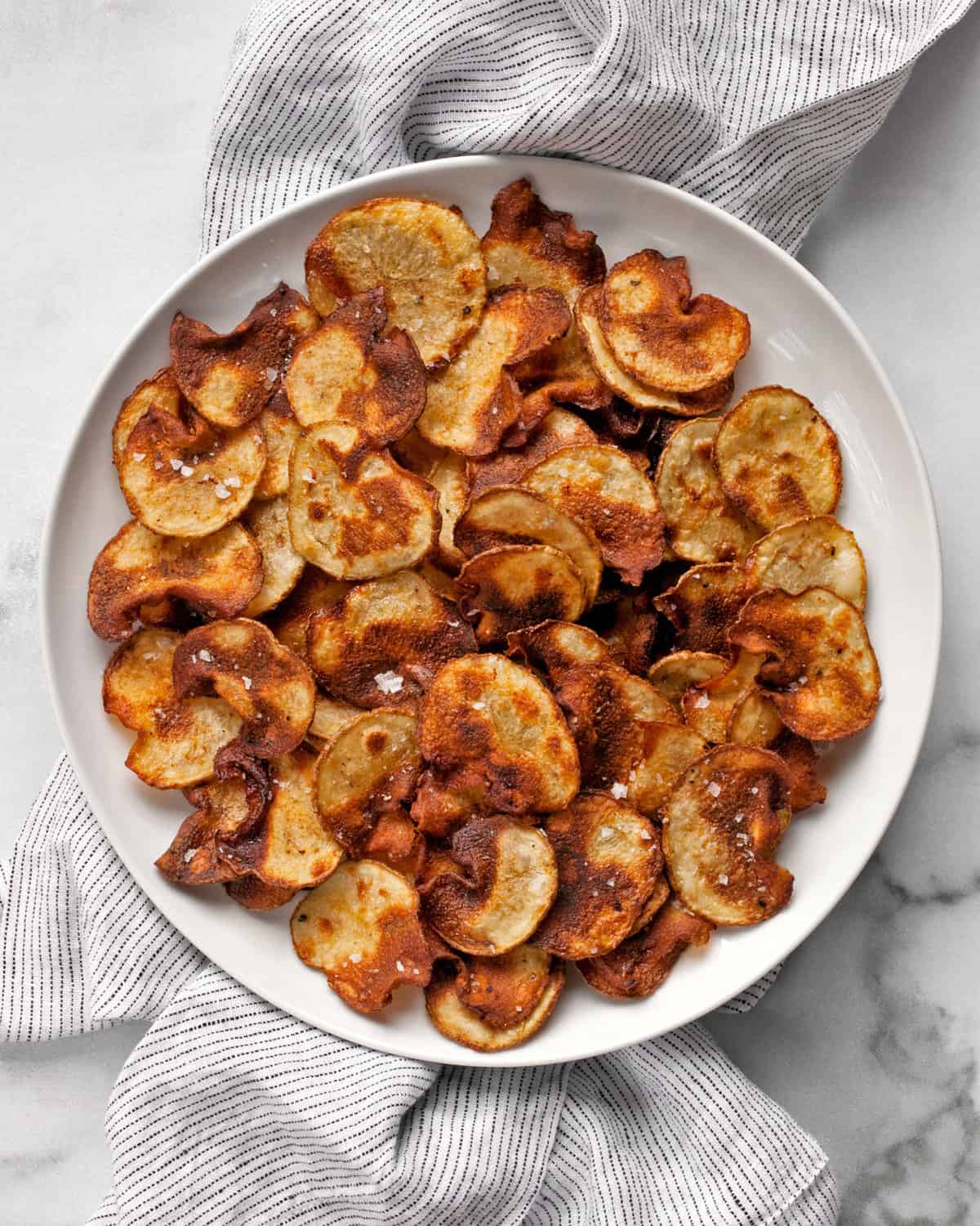 Plate of homemade potato chips.