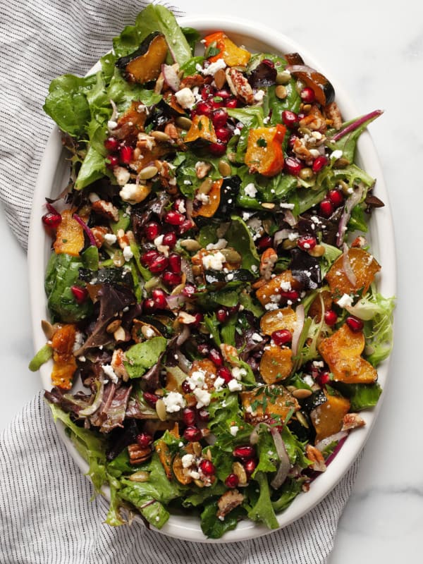 Roasted squash salad on an oval serving platter.