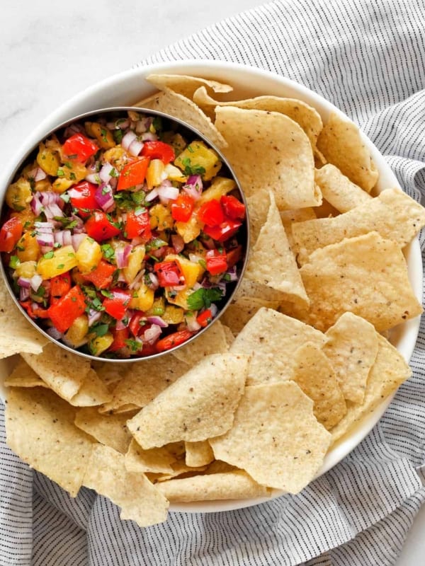 Salsa in a bowl with tortilla chips.