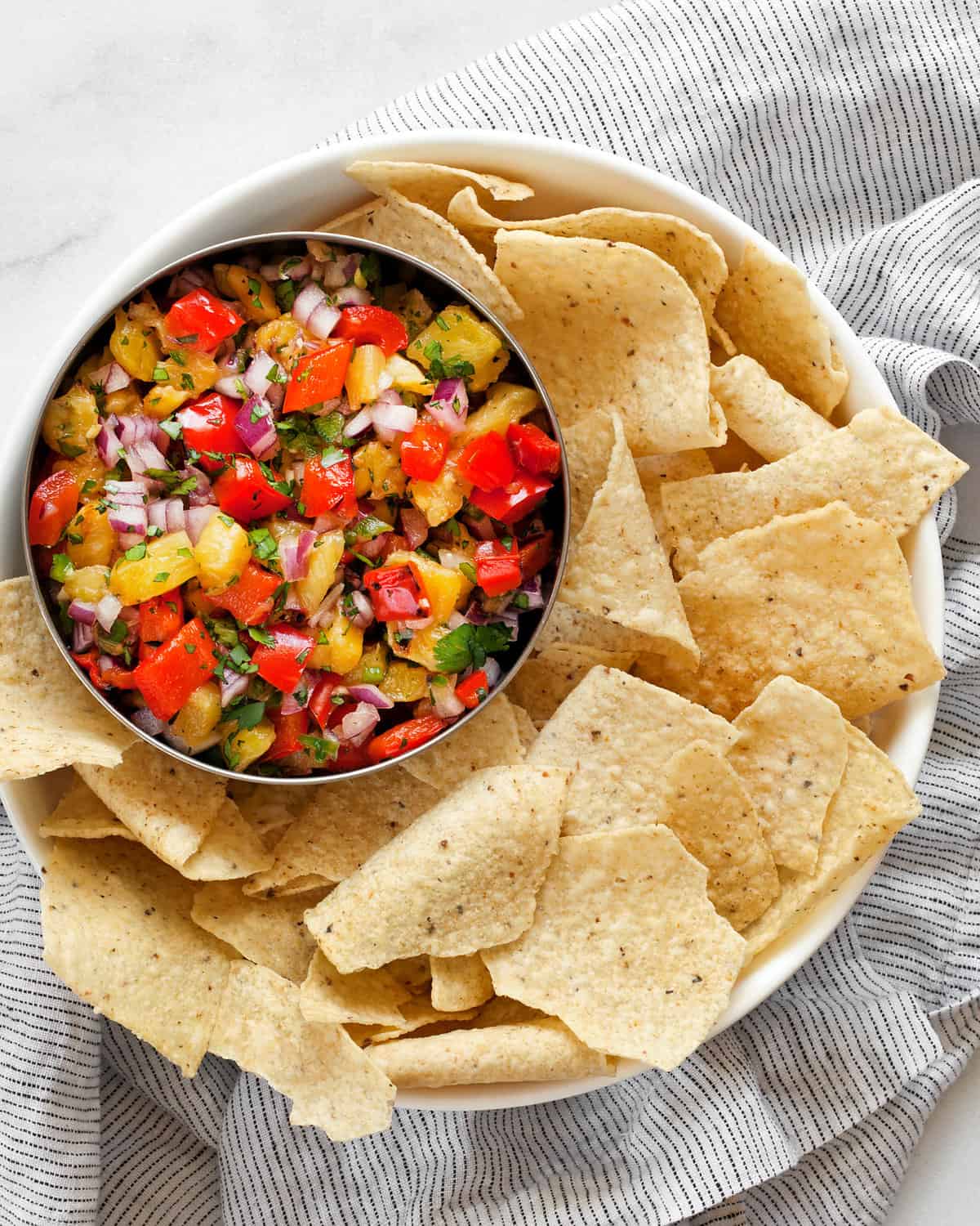 Salsa in a bowl with tortilla chips.