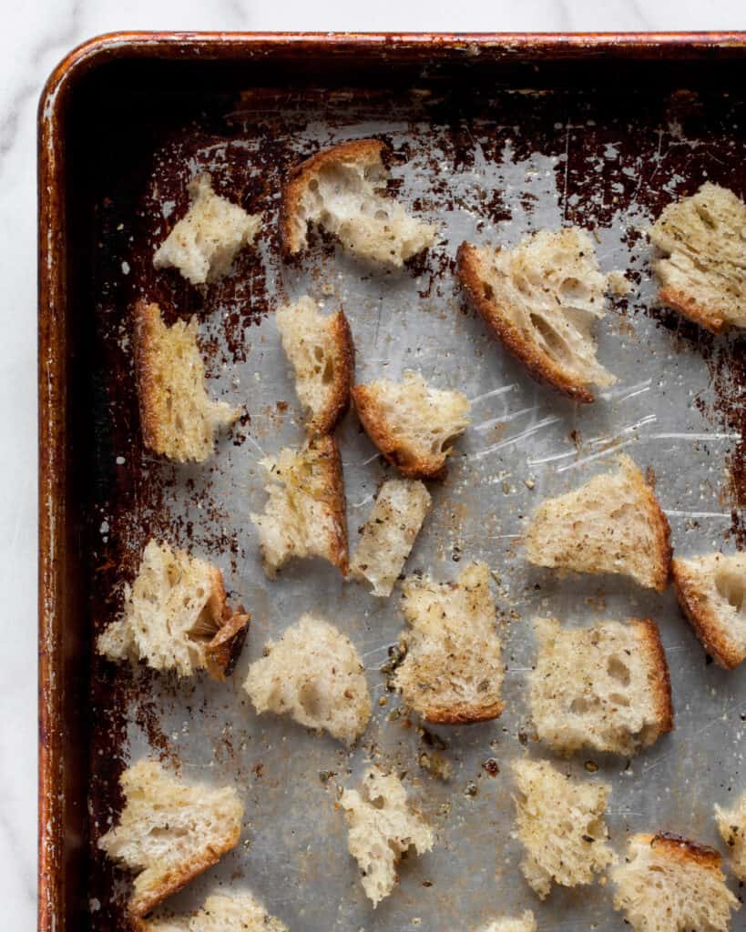 Torn bread on a sheet pan