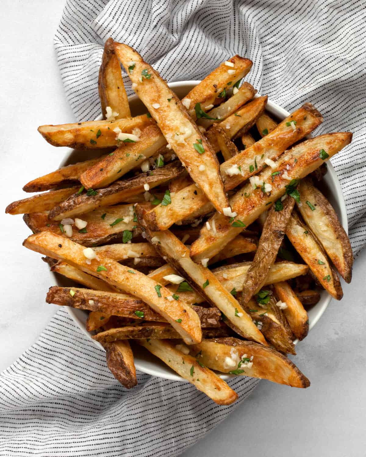Baked garlic fries in a bowl.