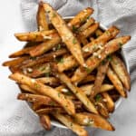 Baked french fries in a bowl.