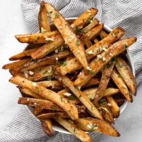 Baked french fries in a bowl.