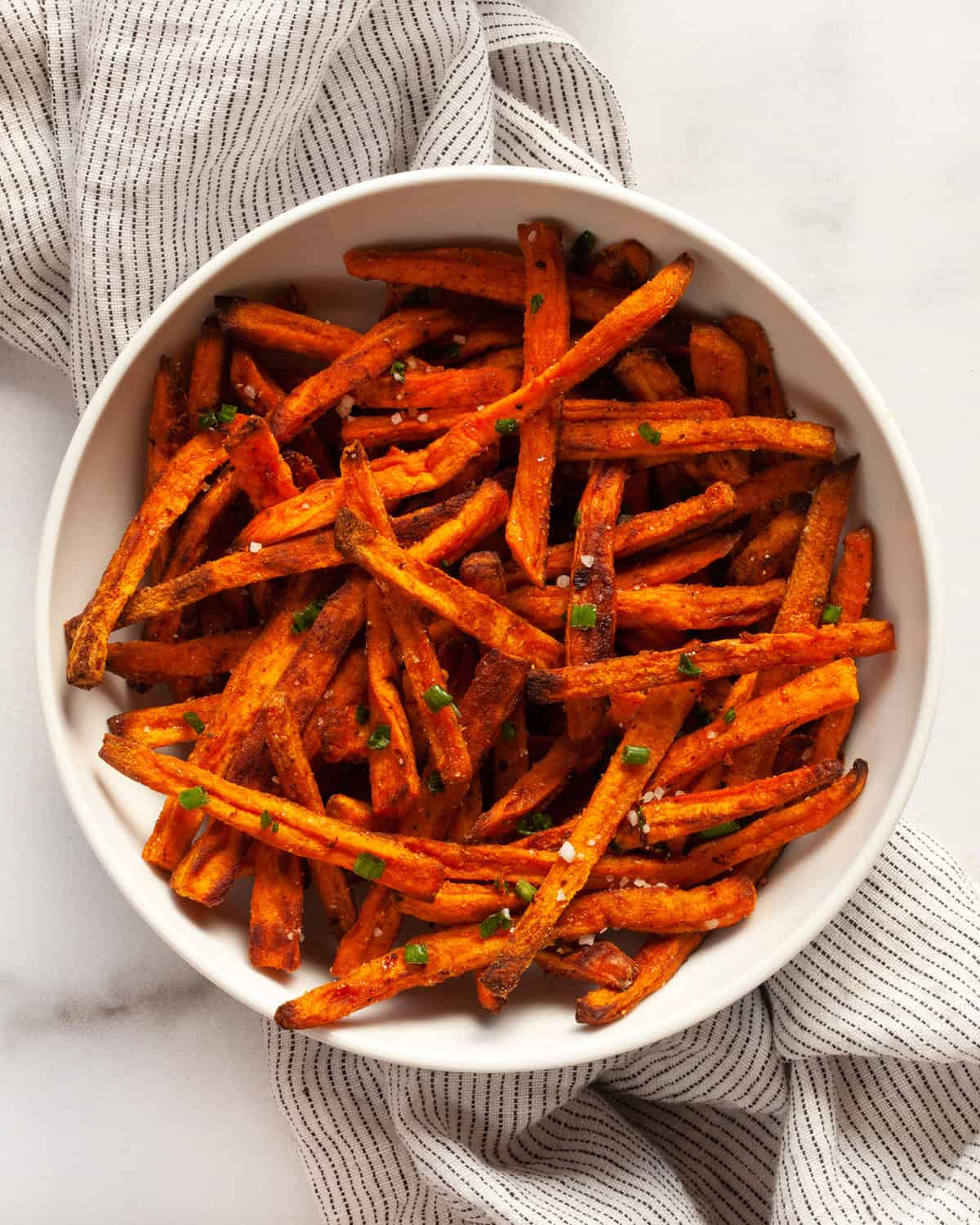 Oven-baked sweet potato fries on a plate.