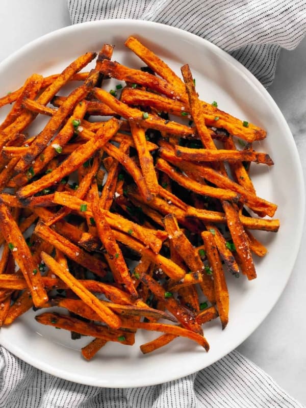 Baked sweet potato fries on a plate.