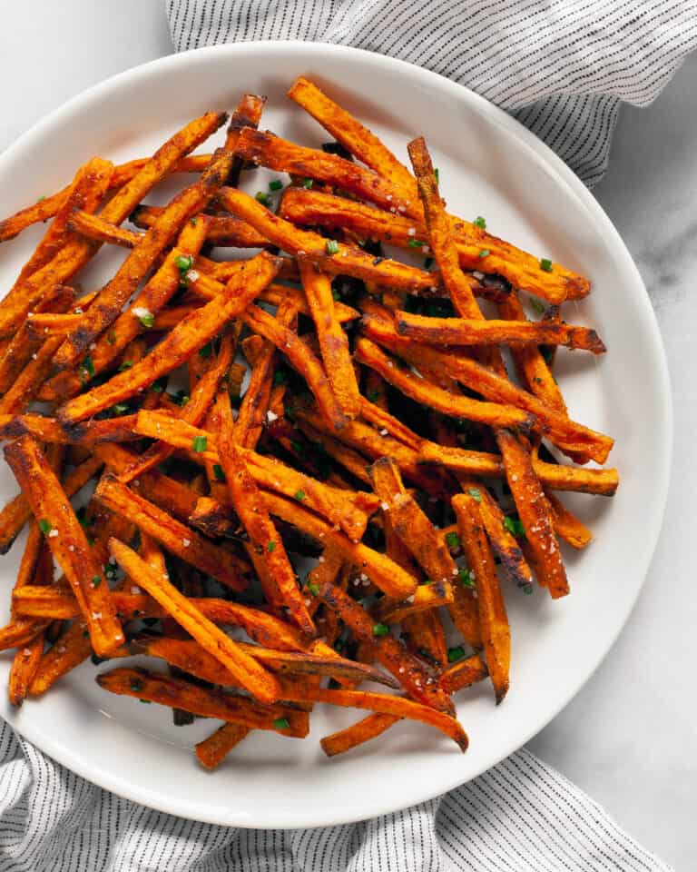 Baked sweet potato fries on a plate.