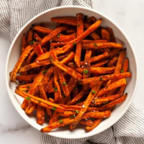 Oven-baked sweet potato fries on a plate.
