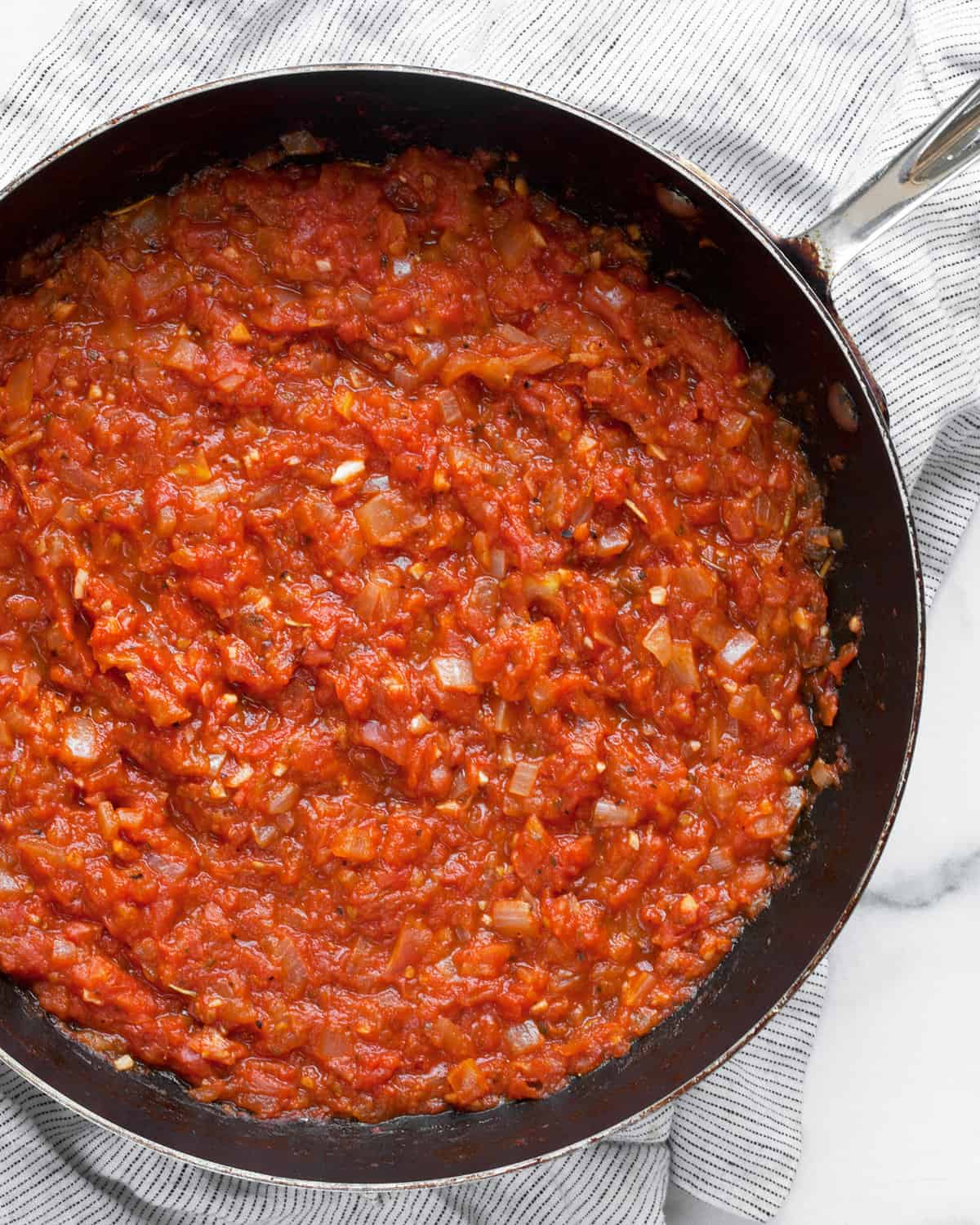 Roma tomato sauce in a skillet.