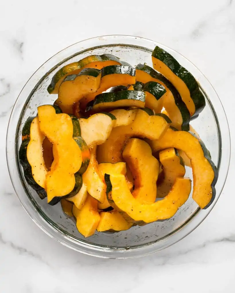 Acorn squash slices in a bowl