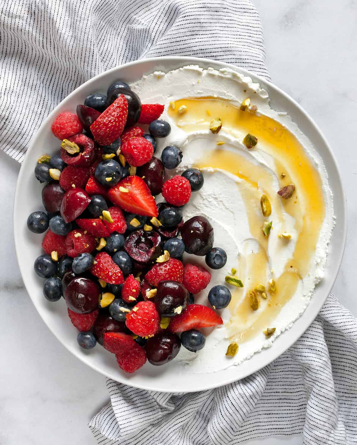 Labneh with fruit, honey and nuts.
