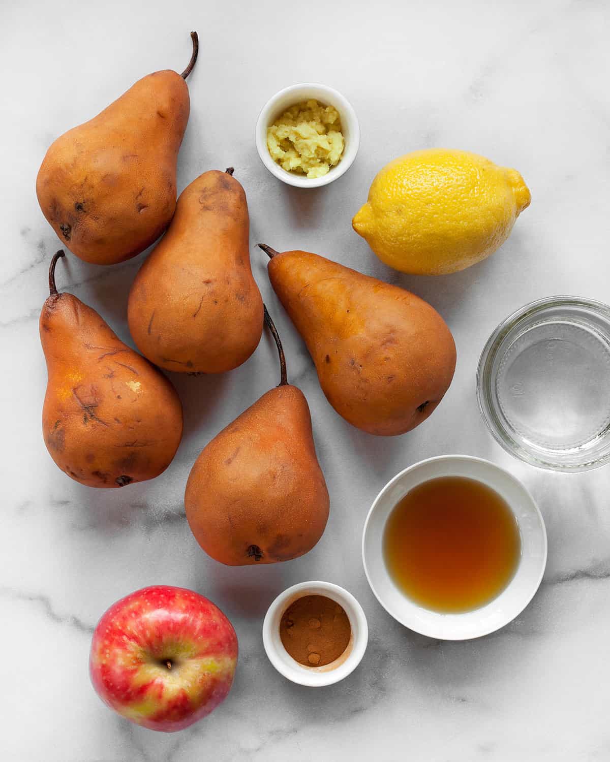 Iingredients including pears, apples, lemon, ginger, cinnamon and maple syrup.