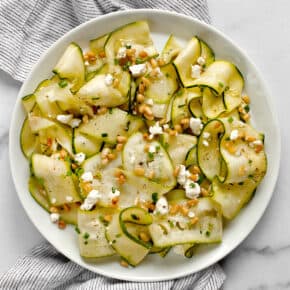 Raw zucchini ribbons salad on a plate.