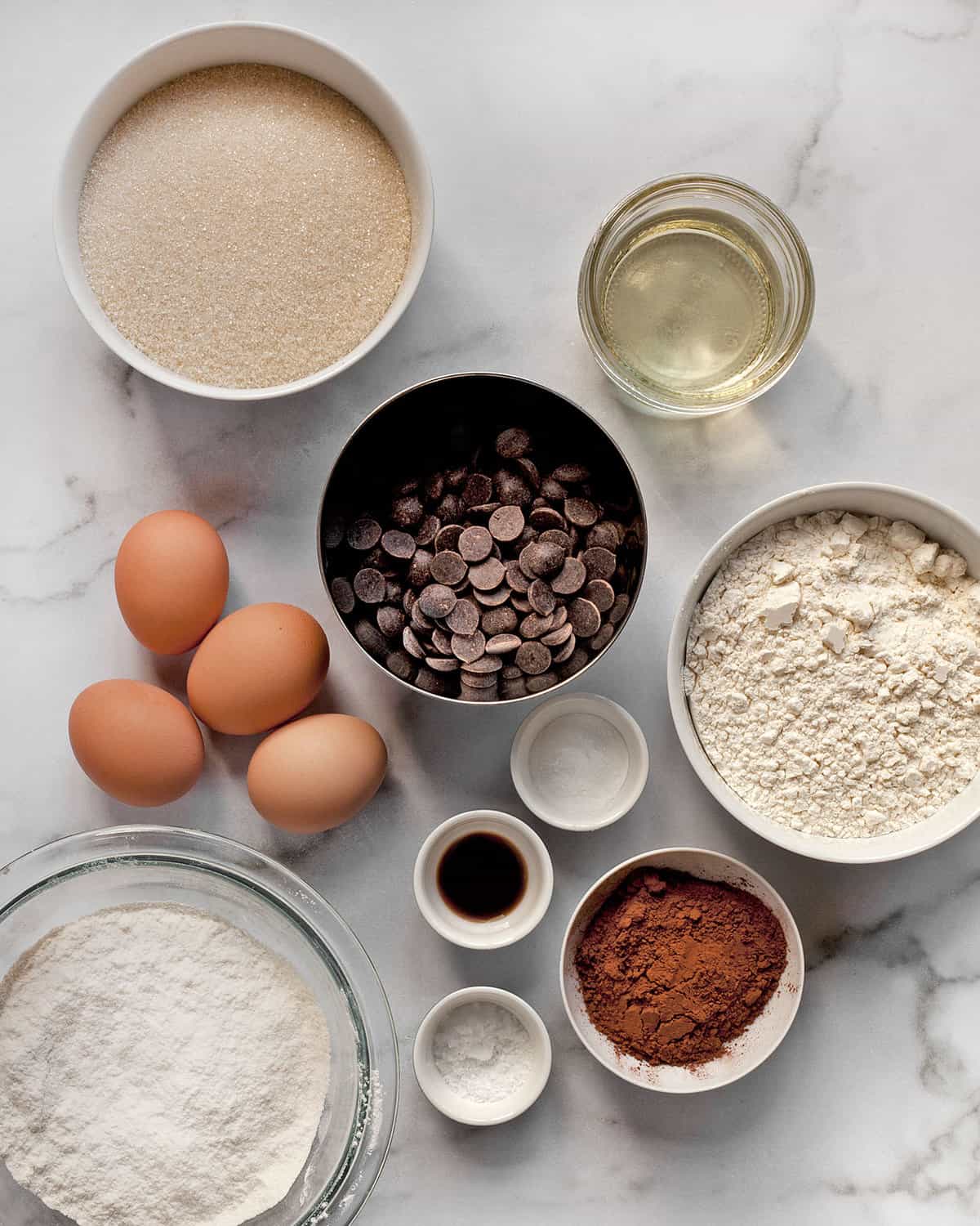 Ingredients including chocolate, cocoa powder, sugar, flour, eggs and salt.