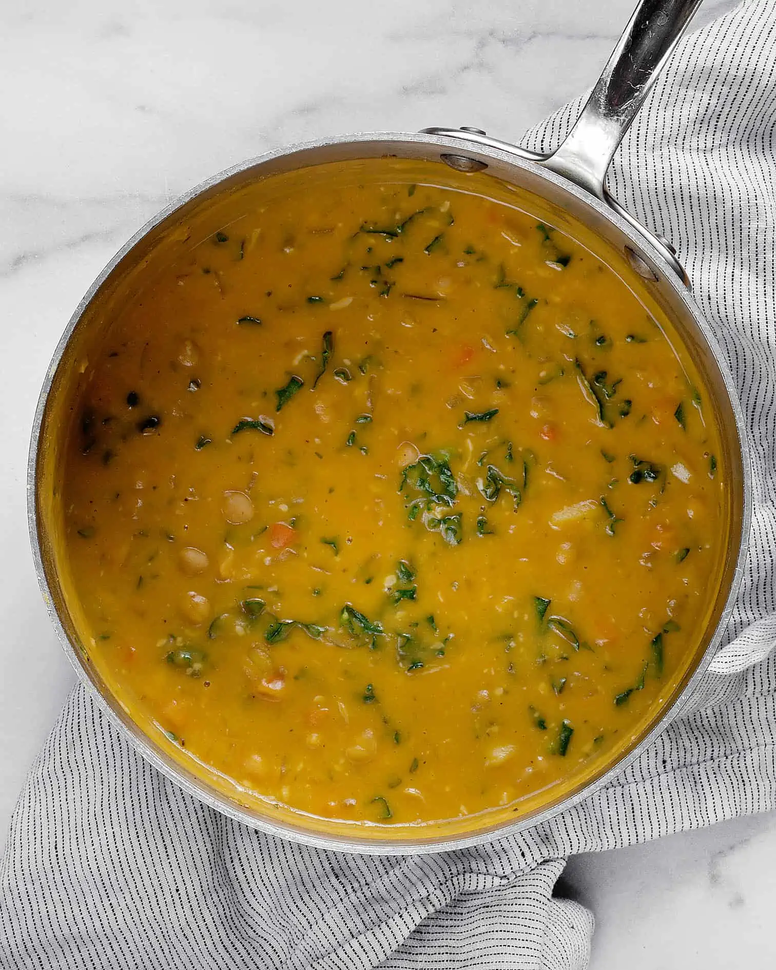 Chickpea soup in a large pot.