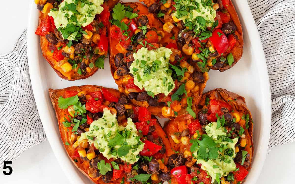 Assembled baked sweet potatoes on a serving plate.