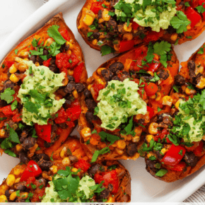 Five stuffed sweet potatoes on a serving plate.