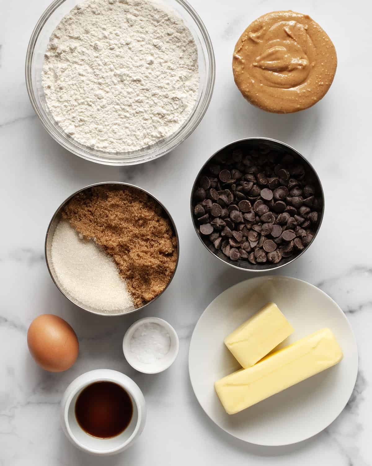 Ingredients including flour, peanut butter, granulated sugar, brown sugar, chocolate chips, butter, egg, salt, baking soda and vanilla extract.