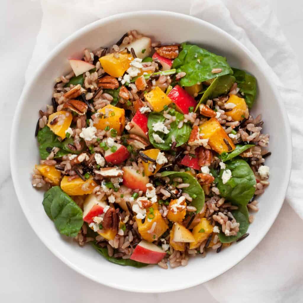Wild rice salad with roasted pumpkin, apples and spinach