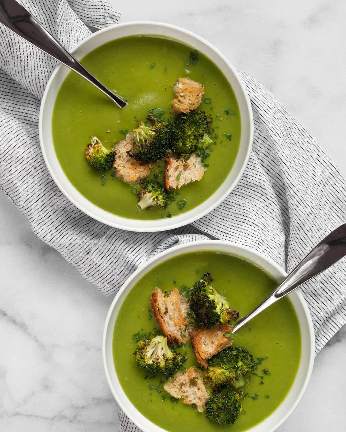 Two bowls of vegan broccoli soup.