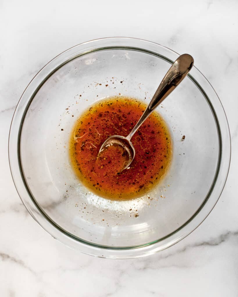 Whisk together the sriracha, lime juice, olive oil, salt and pepper in a bowl
