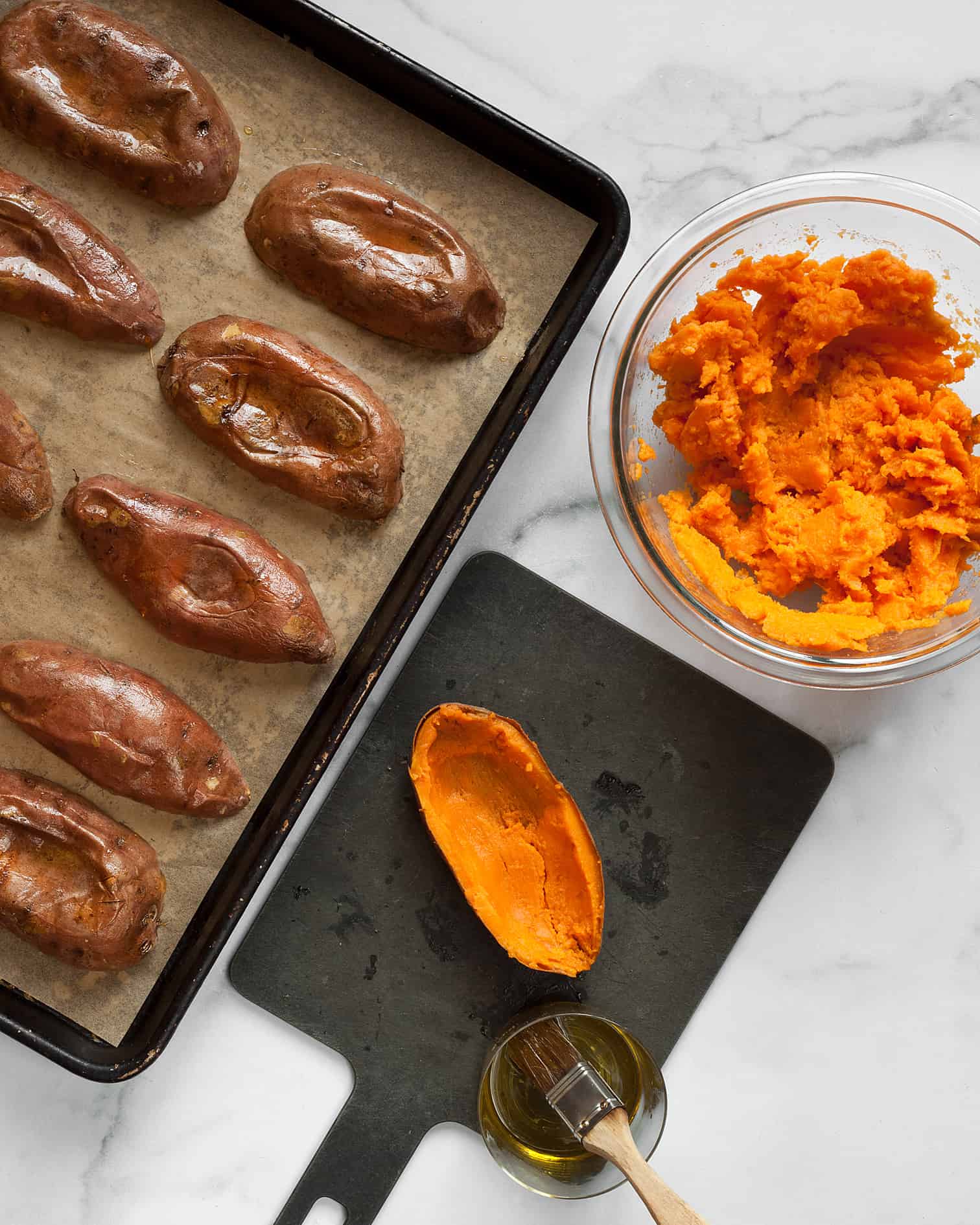 Scoop out the orange flesh and put teh sweet potatoes on a sheet pan cut side down
