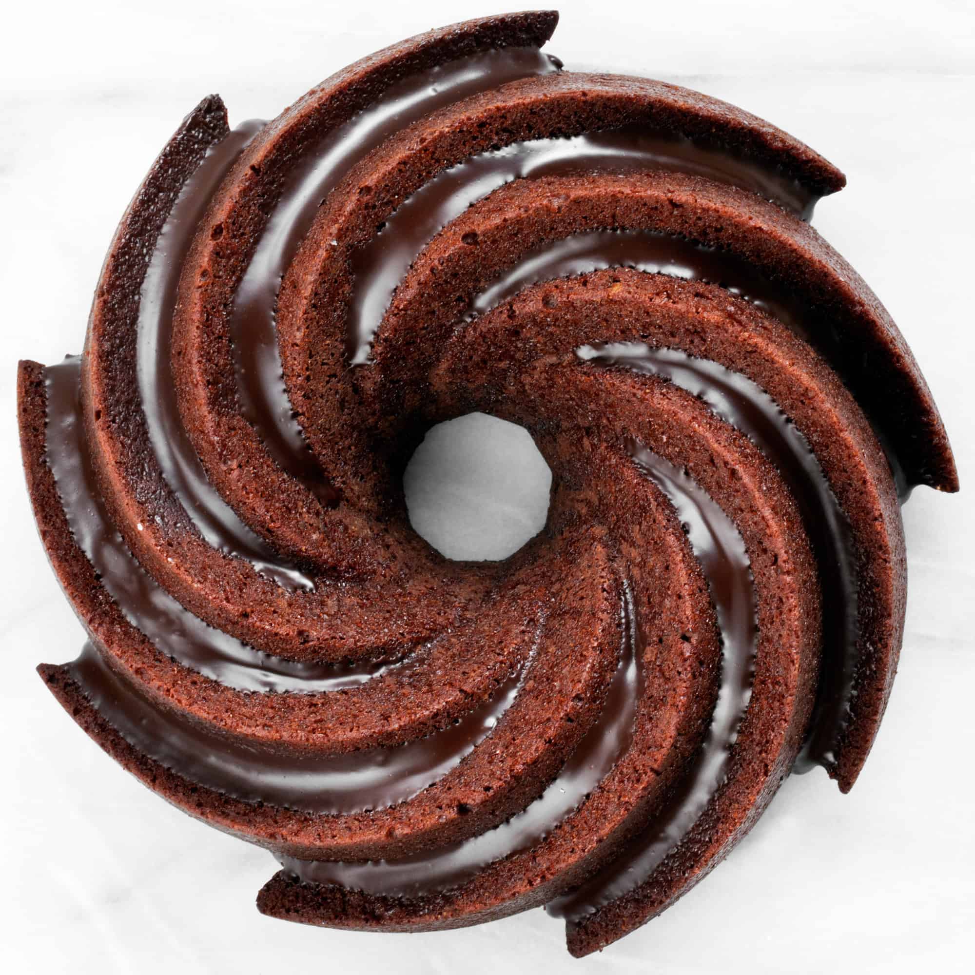 Chocolate bundt cake drizzled with chocolate.