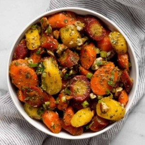 Carrot salad with parsley-cilantro dressing in a bowl.