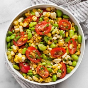 Grilled corn succotash with edamame in a bowl.