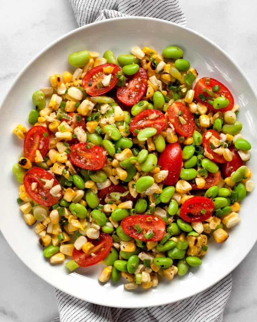 Grilled corn succotash on a plate.