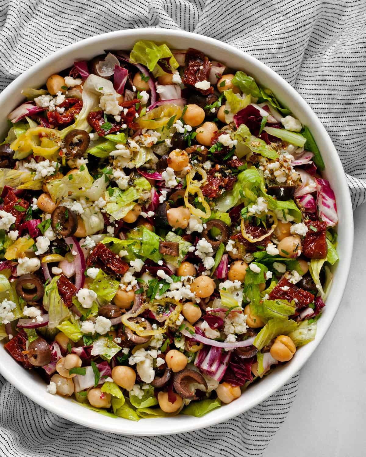 A large serving bowl with an Italian chopped salad.