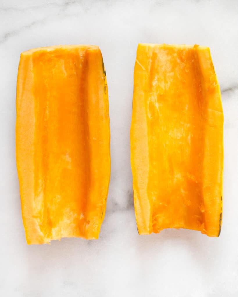 Scoop out the seeds of the delicata squash with a spoon