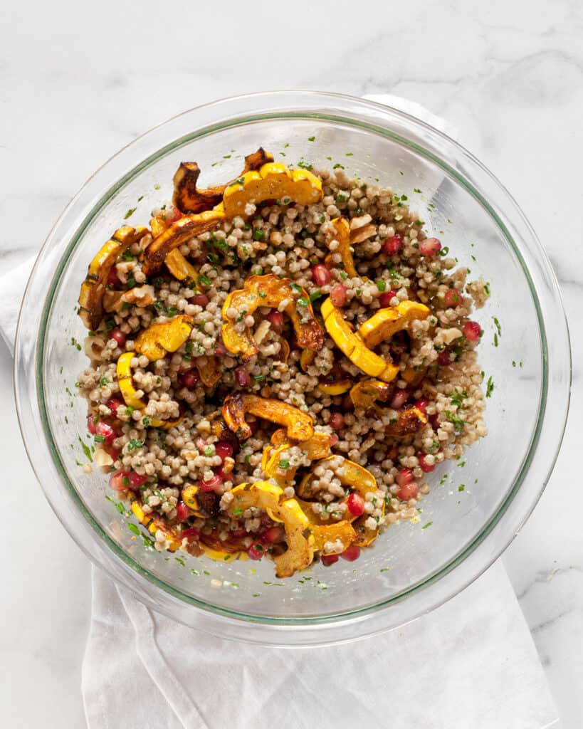Fold the squash and pomegranate seeds into the couscous