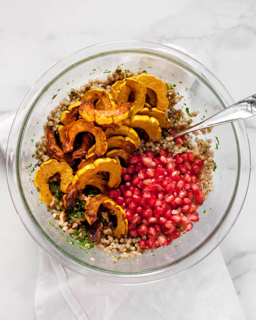 Fold the squash and pomegranate seeds into the couscous