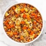 Roasted butternut squash cauliflower quinoa in a bowl.
