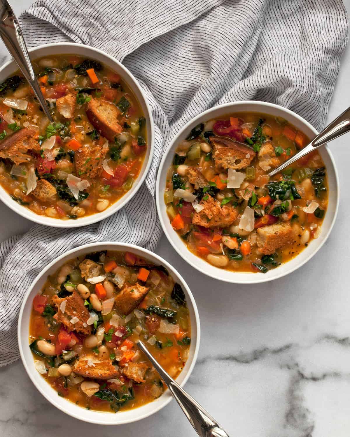 Three bowls of Italian white bean soup.