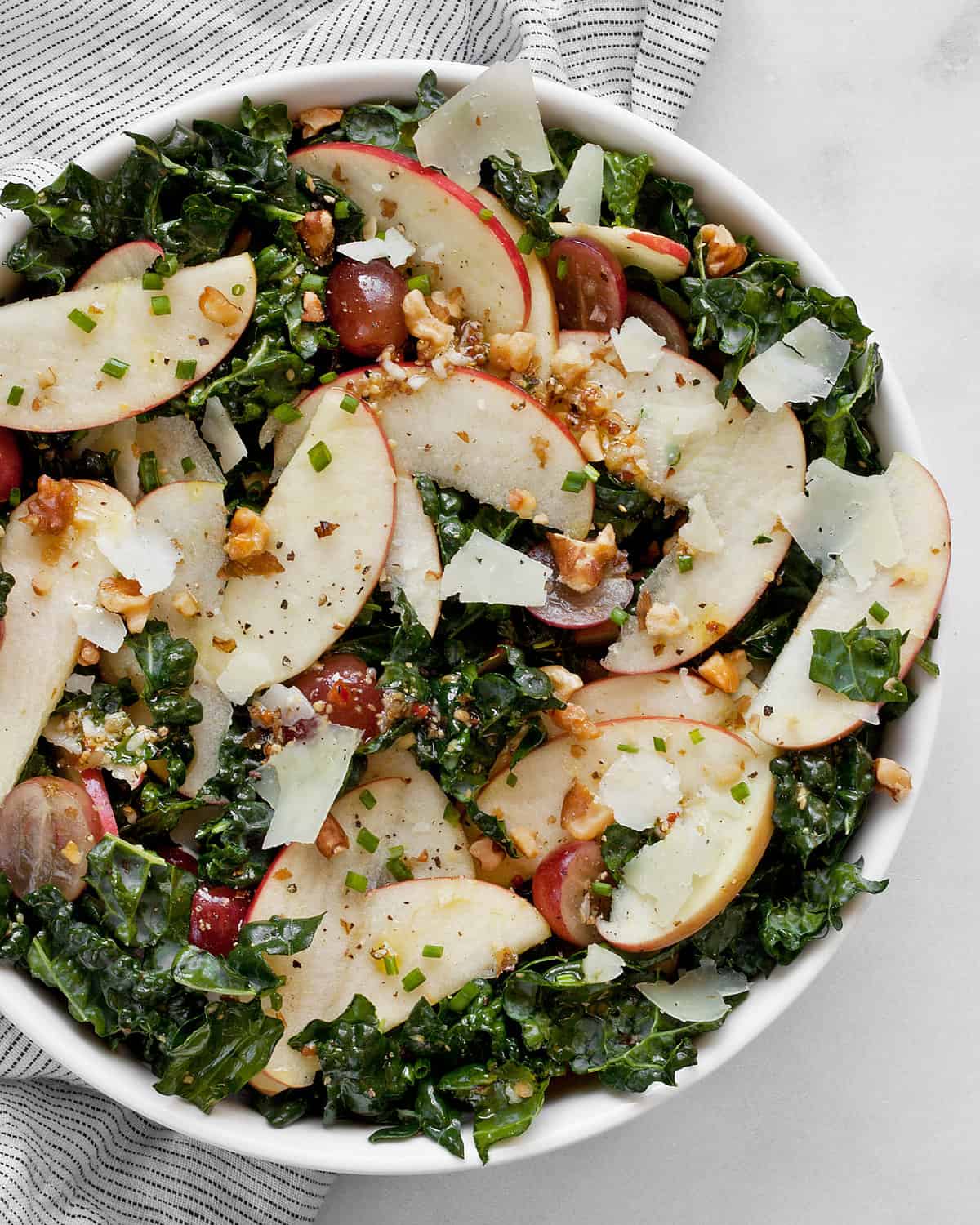 Detail image of kale apple salad in a bowl,