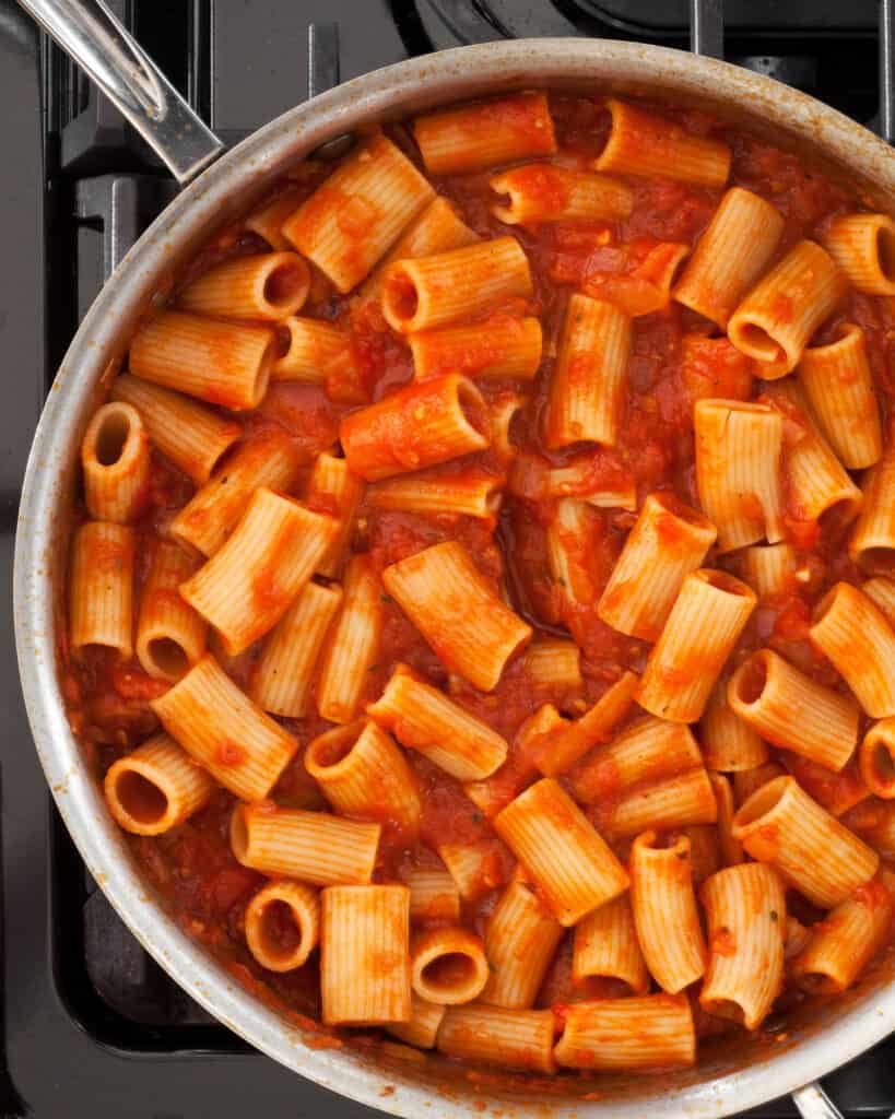Simmer the rigatoni in the tomato sauce