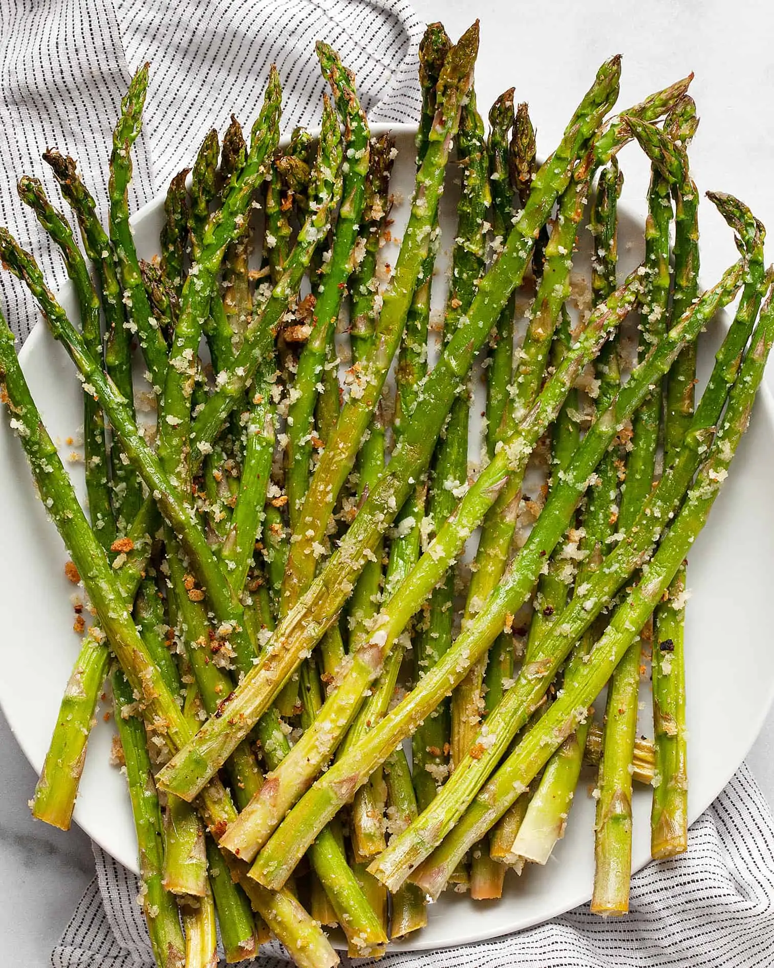Parmesan roasted asparagus on a plate.