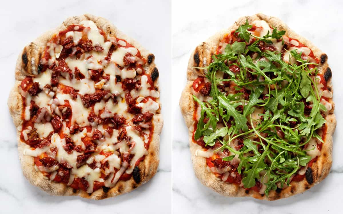 Cooked pizza with cheese and also topped with arugula.